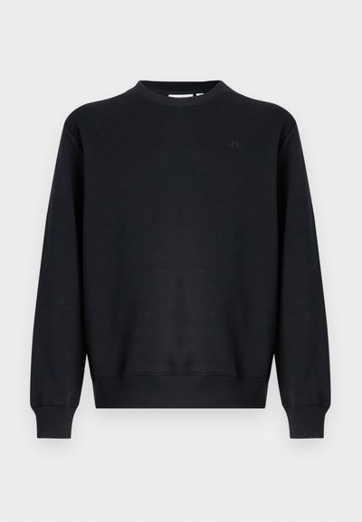 Μαύρο φούτερ από βαμβακερό μείγμα υφάσματος. Λαιμόκοψη τύπου crew, μακριά μανίκια, ριμπ μανσέτες και τελείωμα. Διακριτική λεπτομέρεια με λογότυπο στο στήθος.