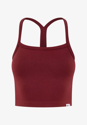 Bordowy, bezszwowy krótki top bez rękawów z wycięciem racerback i małą białą metką marki na dolnym brzegu.