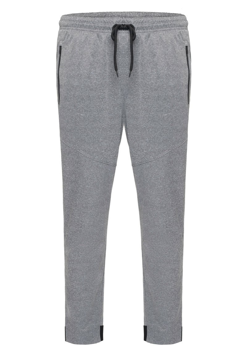 Grå sweatsbukser lavet af blødt materiale, med en elastisk talje med en sort snor, sidelommer og tapered ben.