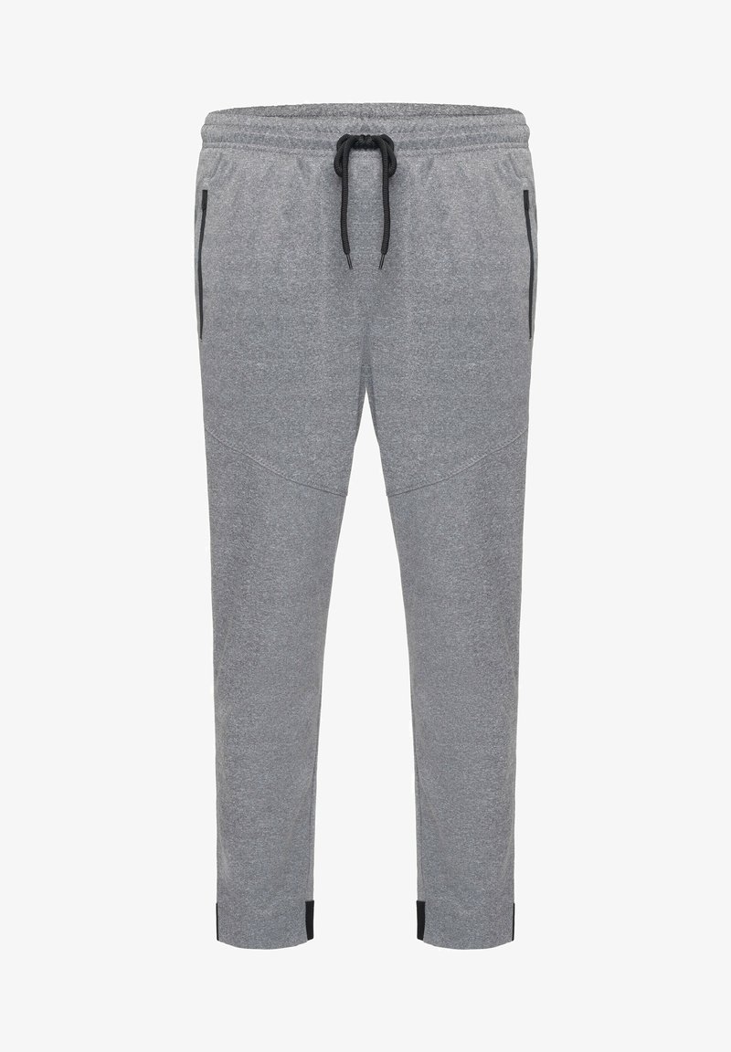 Grå sweatpants gjorda av mjukt material, med ett elastiskt midjeband med svart dragsko, sidofickor och smalnande ben.