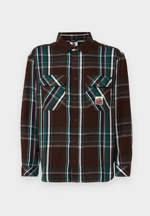 Bruine geblokte overhemd met een kraag, twee borstzakken en knoopsluitingen. Het materiaal is zacht en heeft groene en witte accentstrepen.