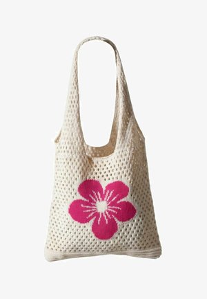 Sac fourre-tout en mesh couleur crème avec une large bandoulière et un grand motif de fleur rose au centre avant.