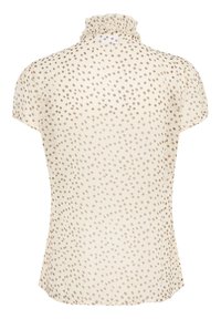 Blusa a maniche corte color crema con collo arricciato e motivo a macchie irregolari marroni. Tessuto leggero e trasparente con silhouette fluida.