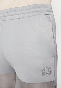 Ellesse SOPRANZI PANT - Donji dijelovi trenirke - grey