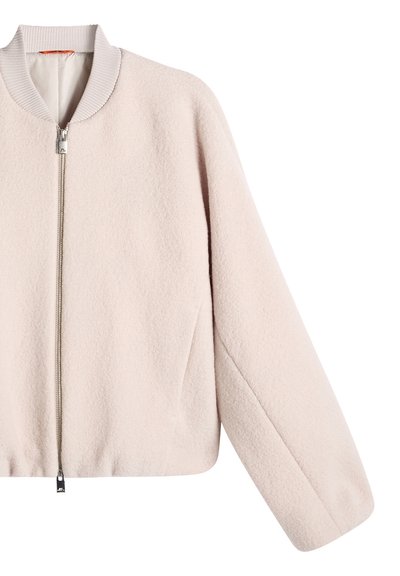 Beige wool jacket with silver front zipper, ribbed collar, and long loose sleeves on a white background.