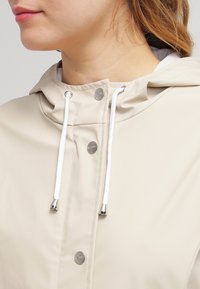 Rains TRENCH - Parka - sand