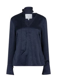 Mörkblå blus i en texturerad tyg, med V-ringning och draperad krage. Långa ärmar med insvängda manschetter och subtila detaljeringar.