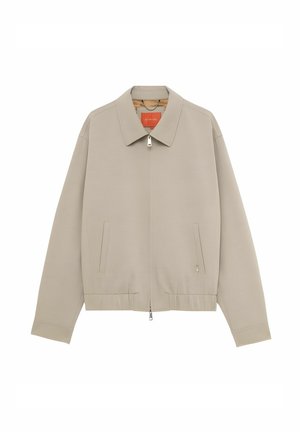 Giacca beige con zip, collo, maniche lunghe, orlo elastico e due tasche verticali a fessura sul davanti.