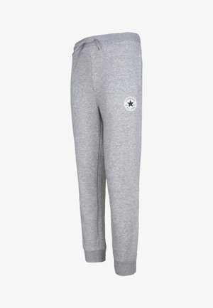 Joggers cinzentos de algodão com um cós elástico e cordão, pernas ajustadas e um emblema redondo no lado esquerdo da coxa.