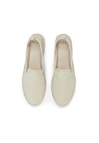 Beige suede espadrilles with rope detailing along the sole, rounded toe, and slip-on design. Gold logo on the insole.