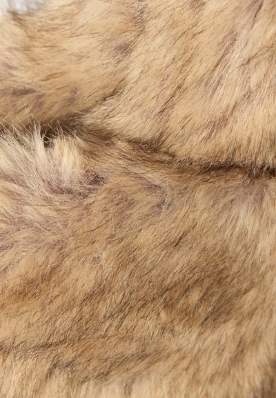 Faux fur fabric in light brown with dark streaks. Silky texture with varying hair lengths, featuring a soft, plush appearance.