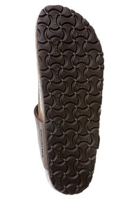 Sola di sandalo marrone con superficie testurizzata caratterizzata da un motivo circolare, realizzata in materiale gommoso, che mostra un design resistente e adatto alla presa.