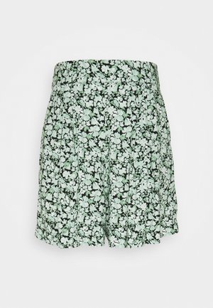 High-waist shorts met zwart, wit en lichtgroen bloemenpatroon en geplooid ontwerp.
