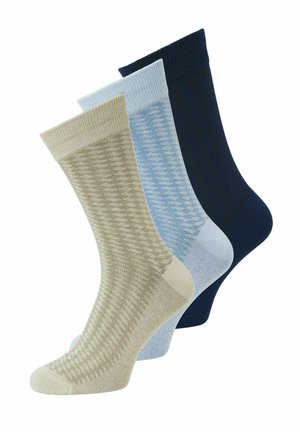 Drie paar kousen tot halverwege de kuit in beige, lichtblauw en marineblauw met een subtiele geprinte gebreide textuur.