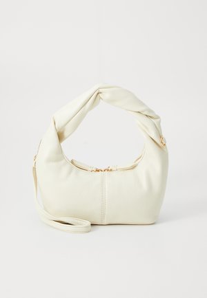 White faux leather handbag with a knotted handle, zip closure, gold hardware accents, and a rounded shape.