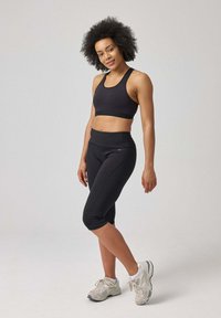 SNOCKS CAPRI - 3/4 sportbroek - schwarz