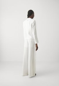 Armani Exchange PANTALONI - Pantaloni - optic white
