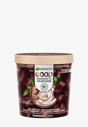 Garnier Goede permanente haarkleur in een ronde, paarse container met een beige deksel. Bevat een label met een formule die voor 90% natuurlijk is en levendige graphics.