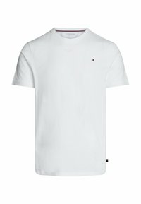 Hvid kortærmet V-hals t-shirt lavet af bomuld. Har et lille logo med en rød og blå stribe på venstre bryst og et mærke på kanten.