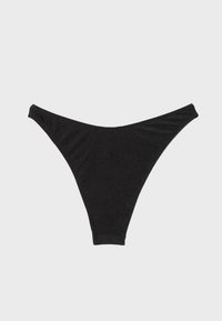 String-tanga noir sans coutures posé à plat sur un fond gris clair, montrant clairement les contours avant et latéraux.