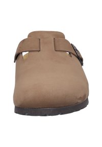 Brown suede clogs with cut-out openings and double strap closures, featuring a textured surface and a sturdy black outsole.