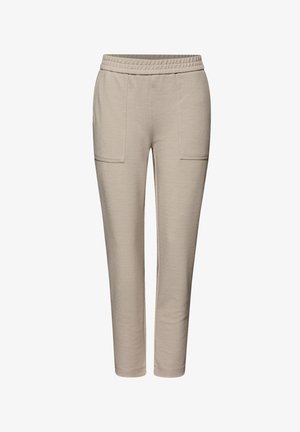 Beżowe dzianinowe spodnie z elastyczną talią, przednimi naszywanymi kieszeniami, zwężanymi nogawkami i fakturowaną tkaniną.