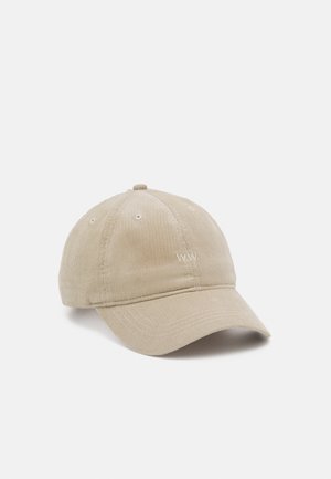 Casquette de baseball en corduroy beige avec six panneaux, brodée du "WW" à l'avant, et œillets pour la ventilation. Visière pré-incurve.