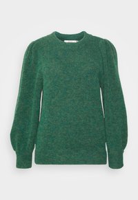 Grön stickad tröja med rund hals, långa pösiga ärmar och strukturerad finish. Mjuk tyg, avslappnad passform och ribbstickad nederkant och ärmslut.