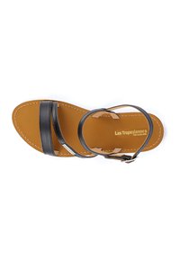 Black leather sandals with two wide straps and a buckle. Light brown insole with stitching details. Brand name printed on the footbed.