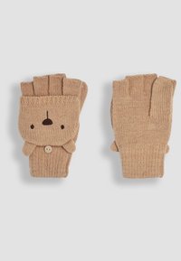 Guanti senza dita in maglia beige con design faccia di orso, dettaglio con bottone e texture a treccia. Dita aperte per una maggiore destrezza.