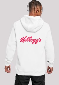 White hoodie with a drawstring hood and ribbed cuffs. Features a large red "Kellogg's" logo on the back. Soft fabric texture.