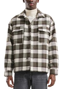 Geruite jas van wolmix met groene en witte patronen, twee voorzakken, knoopsluiting en een kraag.