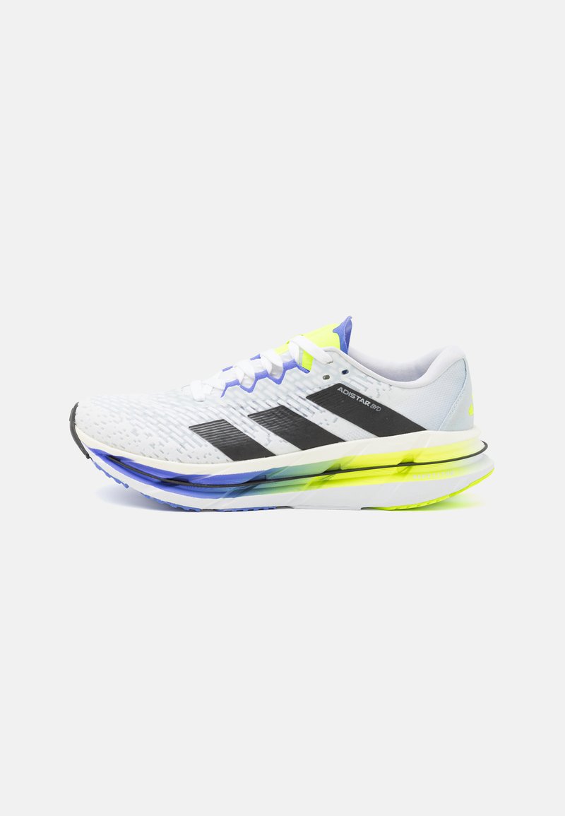 White running shoe with black stripes, yellow accents, and a textured mesh upper. Features a colorful, layered sole with a smooth finish.