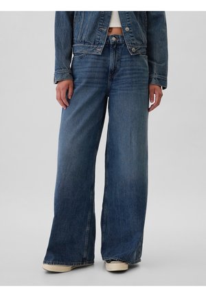 Wijdvallende blauwe denim jeans met een hoge taille, gekenmerkt door subtiele vervaging, klassieke stiksels en een knoopsluiting. Textuurstof met een casual uitstraling.
