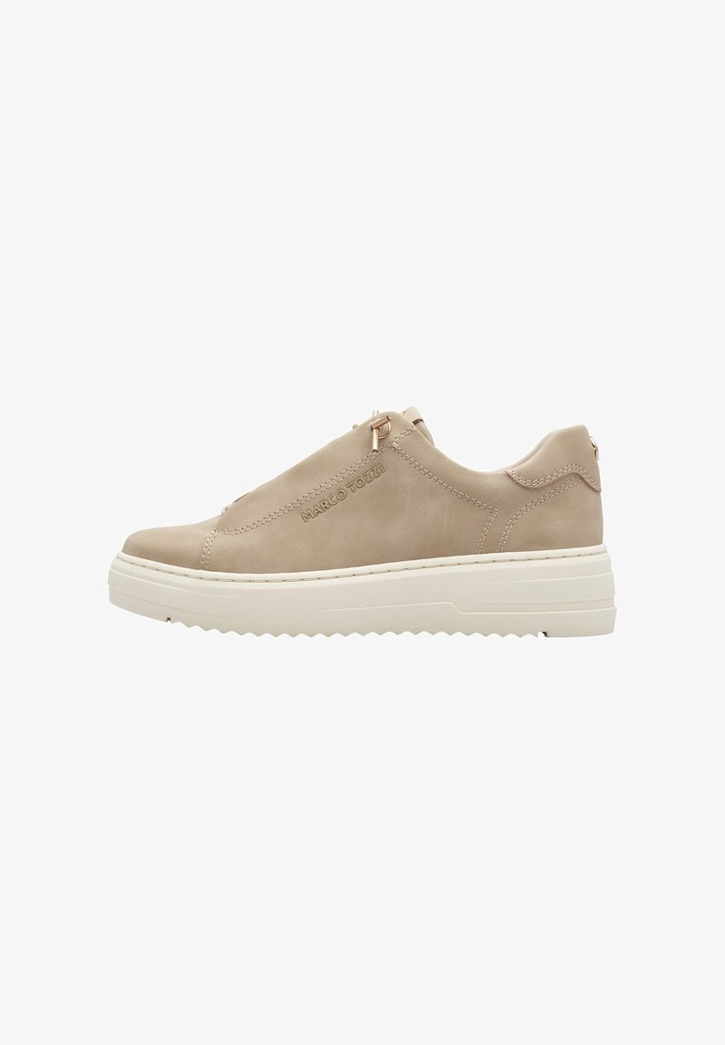 Beige suede sneaker with a low-profile design, white textured sole, and gold-tone zipper accents. Logo embossed on the side.