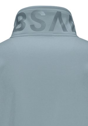 Light blue jacket back with a high collar featuring large, dark partial letters printed around the inside edge.