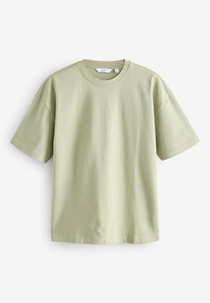 Világoszöld rövid ujjú póló puha pamut anyagból, kerek nyakkivágással és laza szabással, enyhén leeresztett vállakkal.