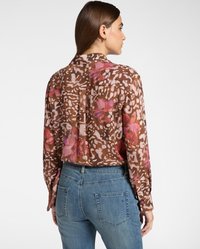 Blusa a maniche lunghe con motivo floreale marrone e dettagli rosa. Tessuto trasparente e vestibilità comoda. Presenta una spalla con yoke dietro e polsini abbottonati.