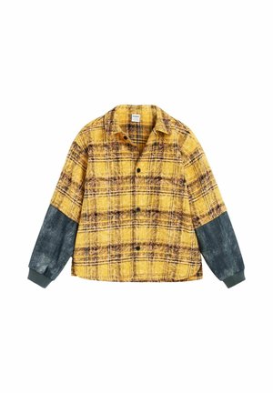 Camicia a quadri gialla e marrone con bottoni, maniche lunghe grigio scuro e polsini a coste, mostrata su sfondo bianco.