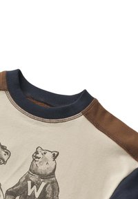 Sweatshirt in cotone a maniche lunghe in crema, blu navy e marrone. Presenta un design grafico con orsi sul fronte, colletto a coste e dettagli cuciti.