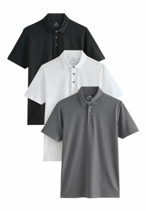Zestaw trzech koszul polo w kolorze czarnym, białym i szarym. Krótkie rękawy, kołnierzyki oraz zapięcia na guziki, a także gładka tekstura.
