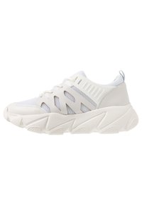 White sneaker featuring a mesh upper with cutouts, cushioned sole, and textured rubber outsole. Reinforced toe and heel accents.