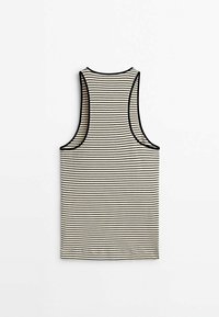 Stribet tanktop i beige og sort. Har en ribbet tekstur og ærmeløs design. Kantbåndet langs halsudskæringen og ærmegabene er sort.
