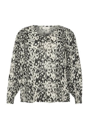 Črna in bela vzorčasta bluza z V-izrezom, dolgimi napihnjenimi rokavi in elastičnimi manšeti; ohlapen kroj in lahka tkanina.