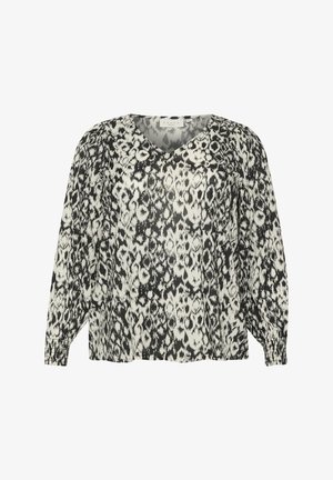 Črna in bela vzorčasta bluza z V-izrezom, dolgimi napihnjenimi rokavi in elastičnimi manšeti; ohlapen kroj in lahka tkanina.