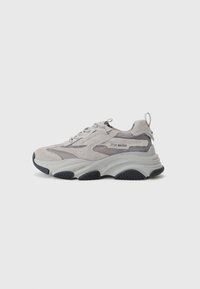 Light grey sneaker featuring a mix of suede and mesh materials, thick rubber sole, and textured accents in a darker shade.