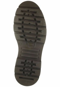 Suela de zapato de goma negra con patrones de surcos profundos, que presenta bandas horizontales elevadas y diseños angulares para tracción. Tamaño marcado como 41.