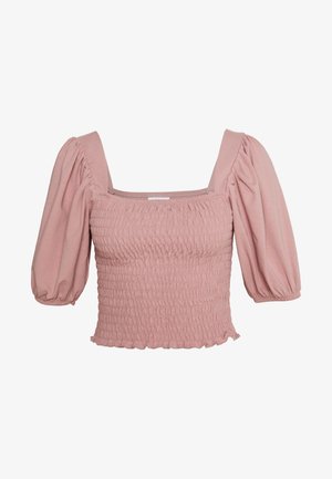 Kortærmet top med smock i blødt lyserødt stof, med firkantet halsudskæring, puffede ærmer og flæsekant. Fremhævet af teksturerede detaljer.