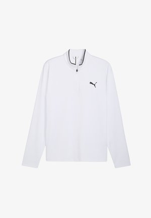 Vit långärmad skjorta med kvartszipp i halsen, med en svart logotyp på bröstet och en mjuk, andningsbar tygstruktur.