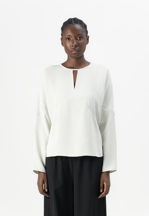 PANELED - Bluse - chalk